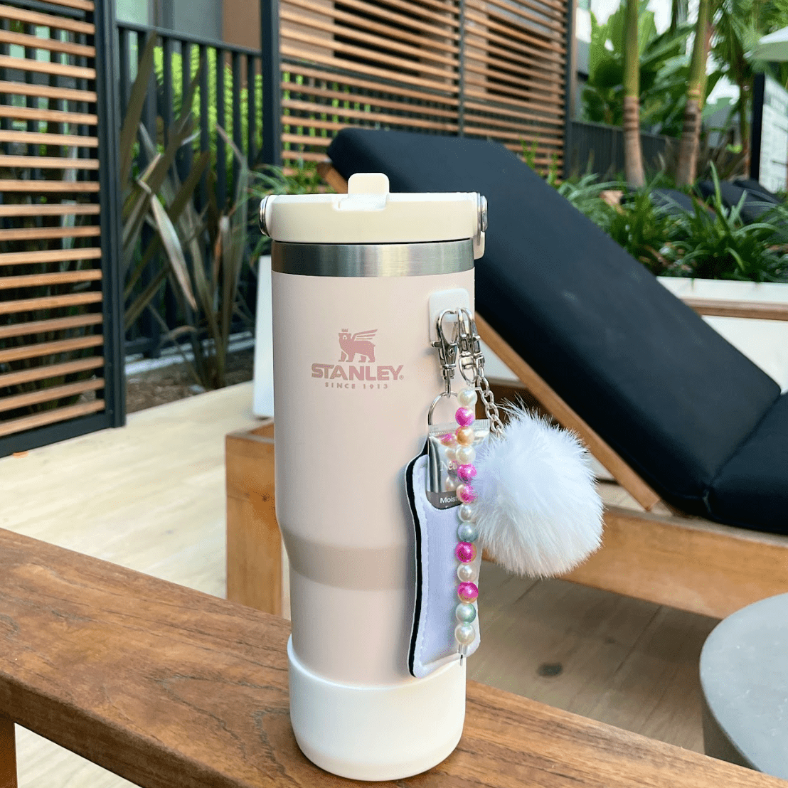 Minimalist white pom-pom and charm decor