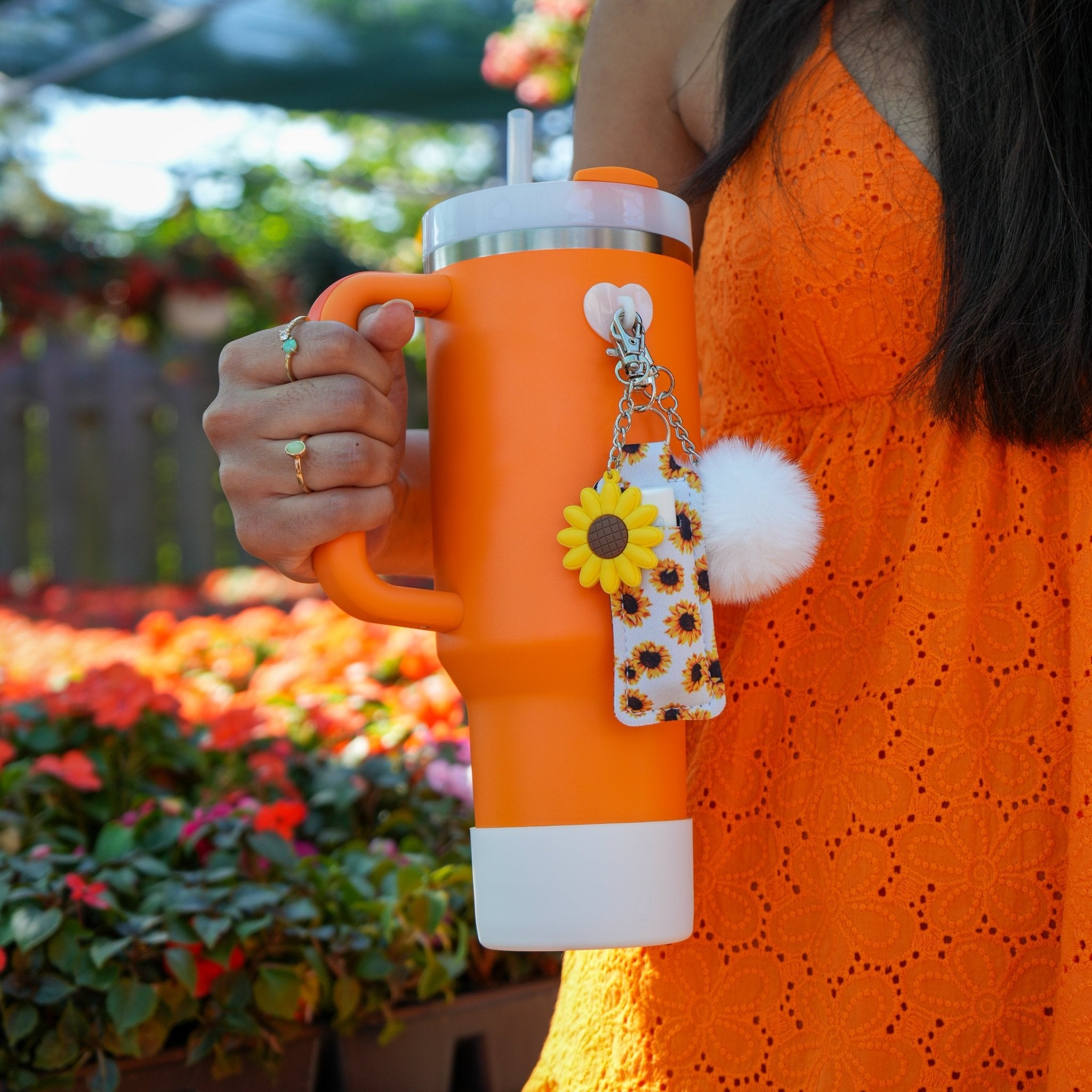 Close-up of lemon chapstick holder and sunflower charm