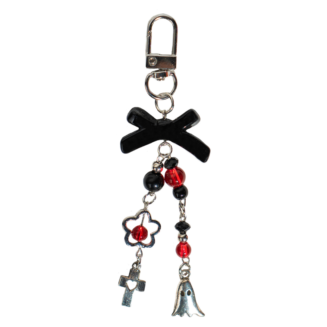 CharCharms black bow bottle charm featuring red and black beads with silver ghost and cross pendants on a white background