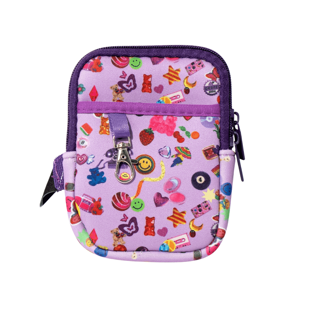 Flat lay of pink and purple essentials pouch decorated with colorful stickers for tumbler or school use